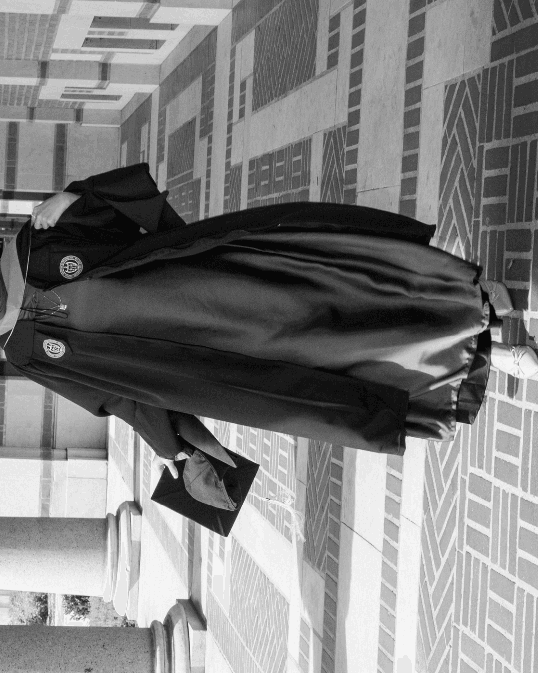 Graduate celebrating in cap and gown