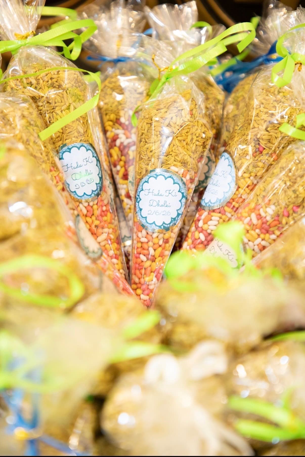 Cone-shaped wedding favor bags filled with rice and candy